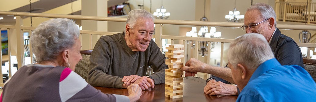 Residents playing a game of Jenga at Ashton Gardens