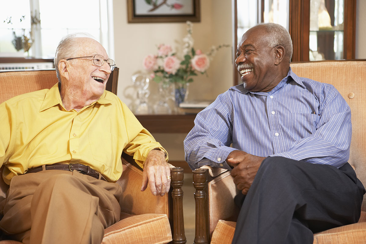 Residents laughing together at Ashton Gardens
